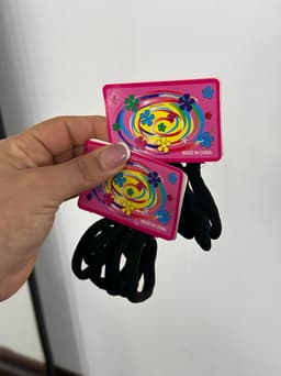 Set de colitas para cabello color negro por  MAYOR ($10 c/u Pack de 12 unidades) - imagen